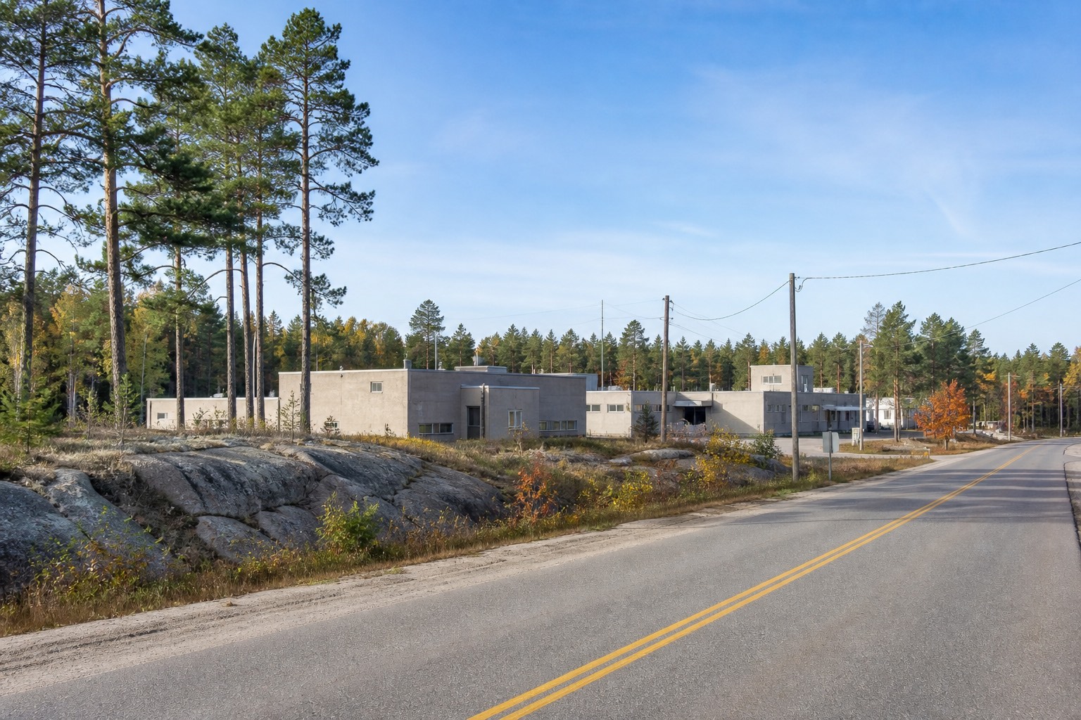Low laboratory buildings at the edge of a northern forest