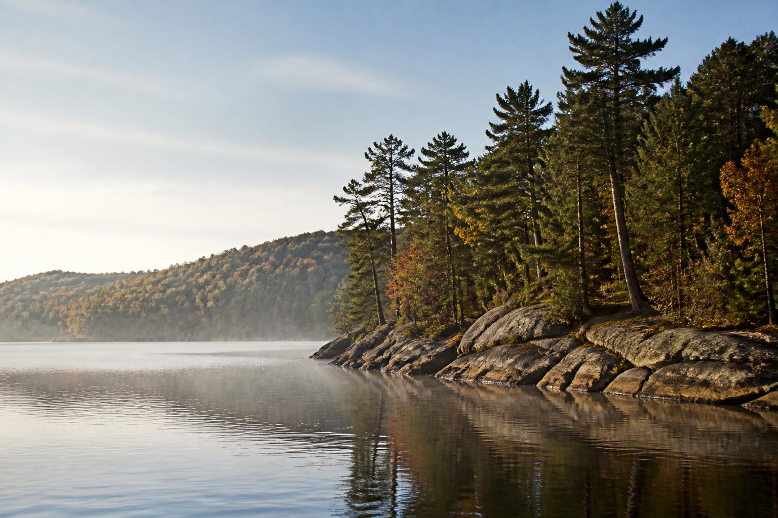 A lake and wooded shoreline near Laurentian Hills in soft morning light